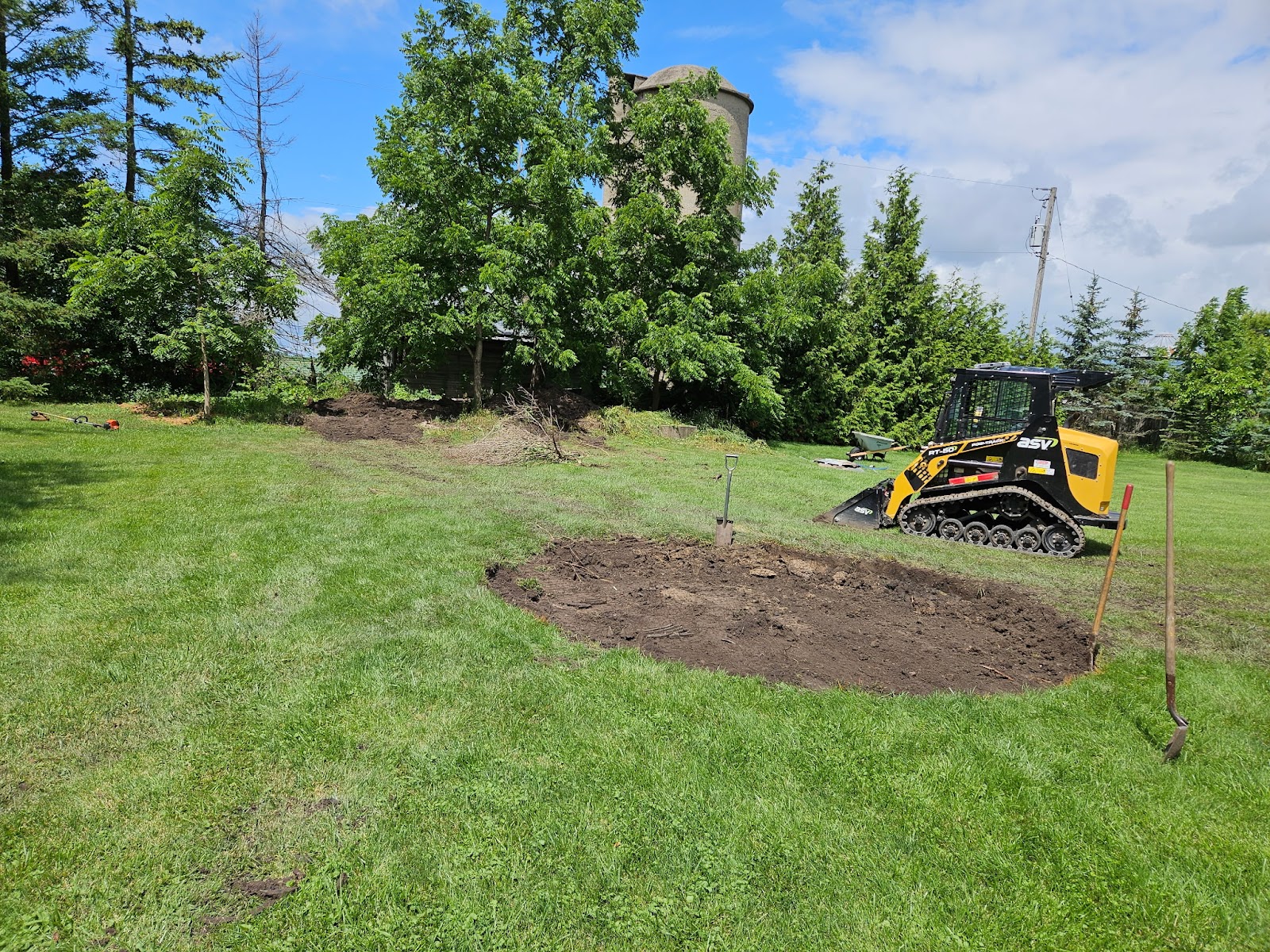 ASV skid steer prepping a landscape bed